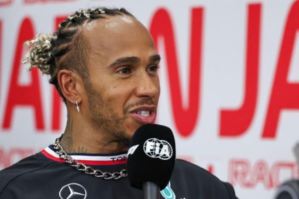 Lewis Hamilton with gold tooth grill