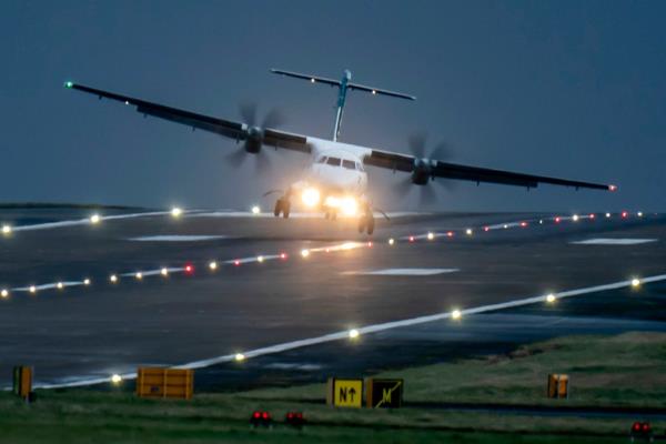 A aircraft lands at Leeds Bradford Airport, England, Thursday