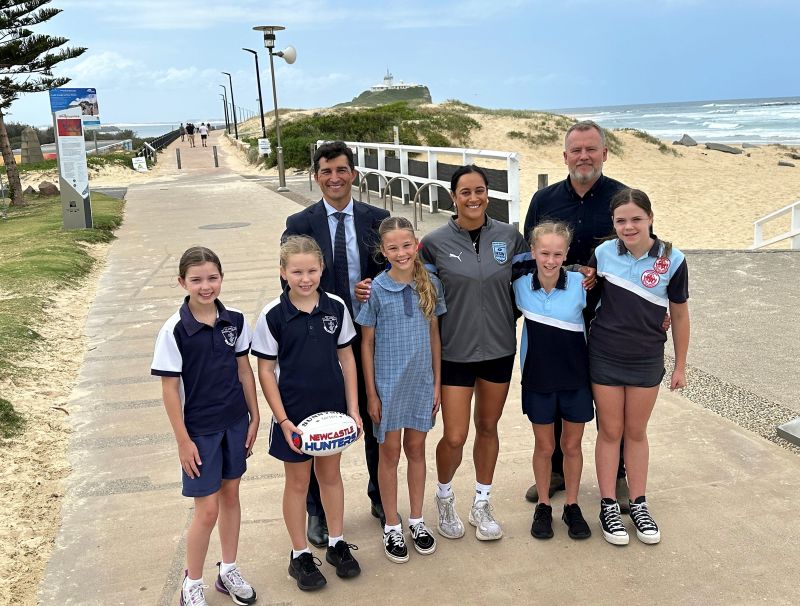 City of Newcastle CEO Jeremy Bath, Newcastle Knights NRLW and NSW State of Origin player Yasmin Clydesdale, McDo<em></em>nald Jo<em></em>nes Stadium Venue Manager Dean Mantle and members of the Newcastle Knights Oz Tag Under 12 Girls State Cup team celebrate the State of Origin announcement today.
