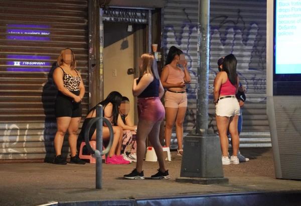 Prostitutes are pictured in Corona, Queens.
