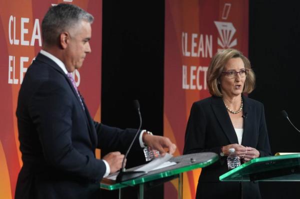 Republican Rep. Juan Ciscomani and Democratic candidate Kirsten Engel debating at a podium during Arizona's 6th Co<em></em>ngressional District debate