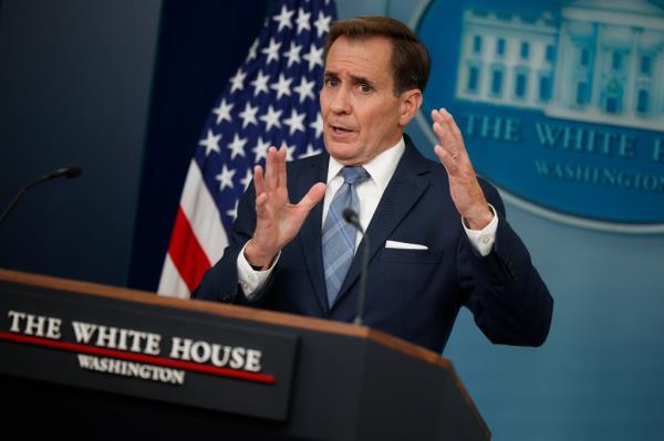 John Kirby, White House Natio<em></em>nal Security Communications Adviser, speaking at a podium in the Brady Press Briefing Room, gesturing with his hands.