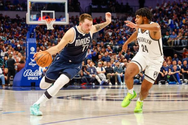 Mavericks guard Luka Do<em></em>ncic (77) drives on Brooklyn Nets guard Cam Thomas (24) during the second quarter