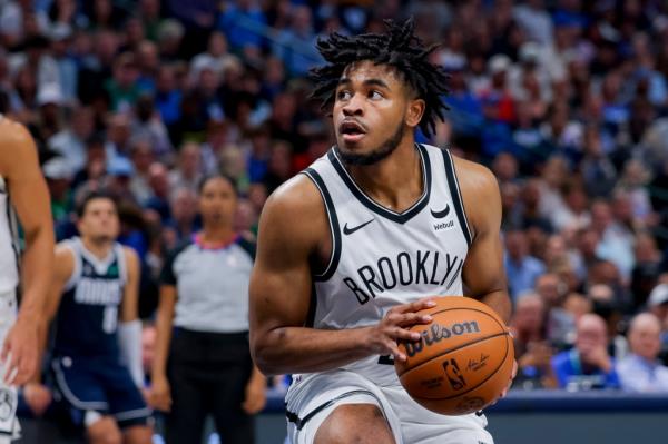 Nets guard Cam Thomas (24) pulls up to shoot during the first half