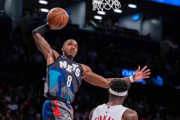 Brooklyn Nets guard Lo<em></em>nnie Walker IV (8) dunks in the second half against the Toro<em></em>nto Raptors at Barclays Center