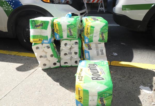 The packs of stolen Bounty paper towels, seen on the ground.