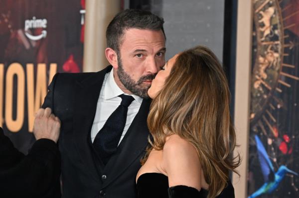 Jennifer Lopez and Ben Affleck kiss as they attend Amazon's 