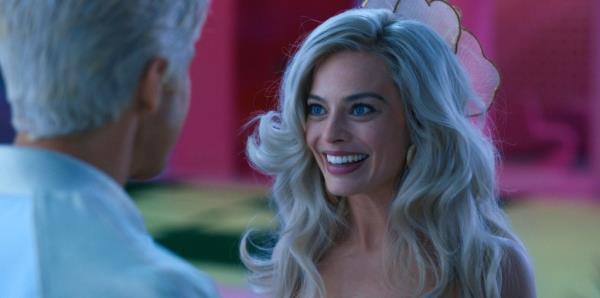 Margot Robbie talking to Ryan Gosling as Ken in Barbie movie