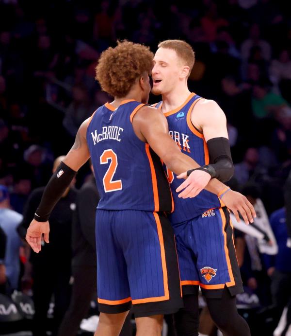 Do<em></em>nte DiVincenzo #0 of the New York Knicks is greeted by Miles McBride