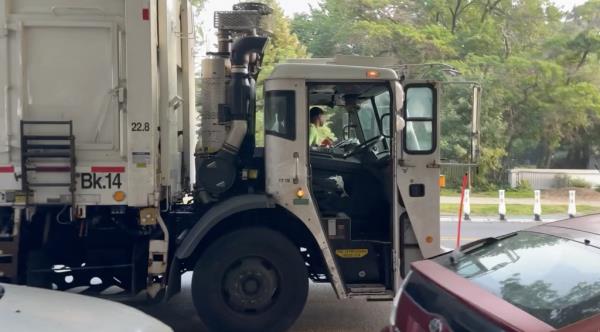Sanitation workers in Brooklyn leave behind strewn trash left on the sidewalk on Parkside Avenue between St. Pauls and Ocean Ave. at around 6:45 a.m.