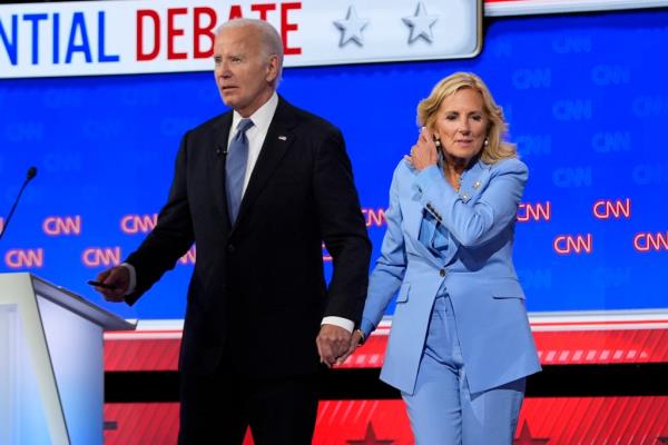 First lady Jill Biden, right, stands with President Joe Biden at the co<em></em>nclusion of a presidential debate
