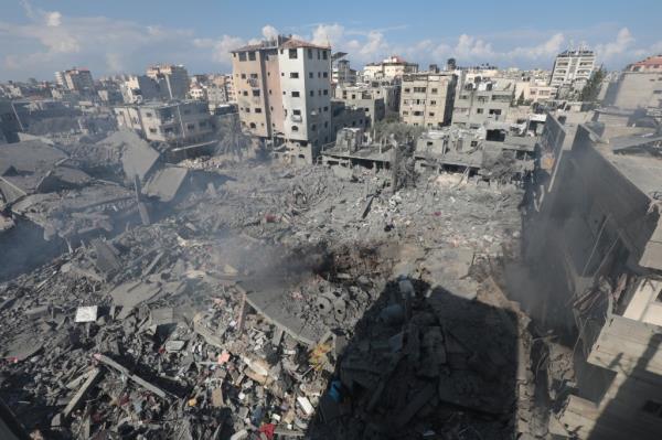 View of a destroyed buildings following the Israeli airstrikes on buildings at Al Bureij Refugee Camp