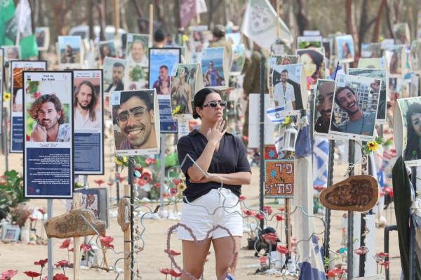 People visit the memorial site for the victims of the 07 October 2023 Supernova music festival attack, near Kibbutz Re'im, close to the border with the Gaza Strip, in southern Israel, 06 October 2024. 