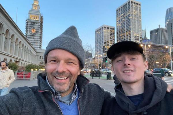 Coley Laffoon taking a selfie with his son Homer in a city whilst wishing him a happy birthday