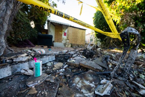 Crime scene tape around debris at the Mar Vista neighborhood house in Los Angeles wher<em></em>e actress Anne Heche crashed her car.
