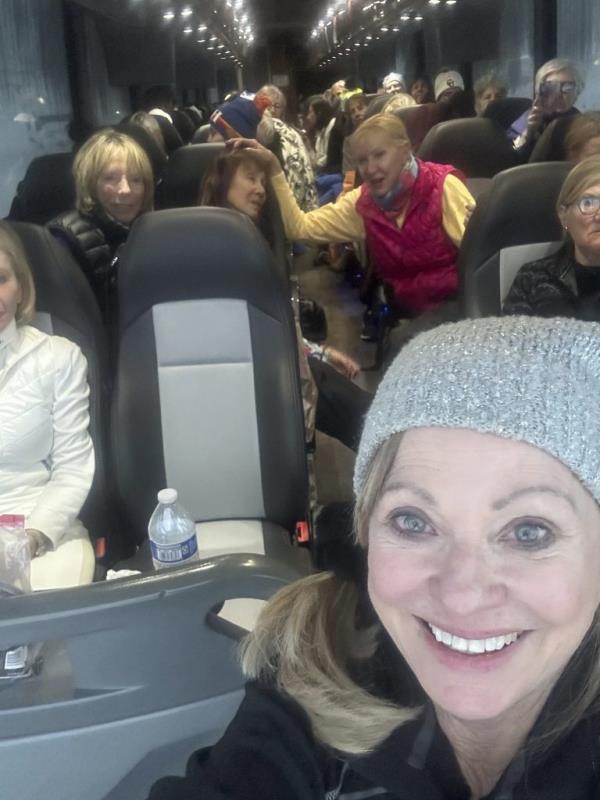 Brenda Djorup, Djorup takes a photo of herself and other women who were stranded on a Thera-ski bus on Interstate 70 in Colorado on the way back from a ski trip to Vail, Colo., Wednesday, March 13, 2024. 