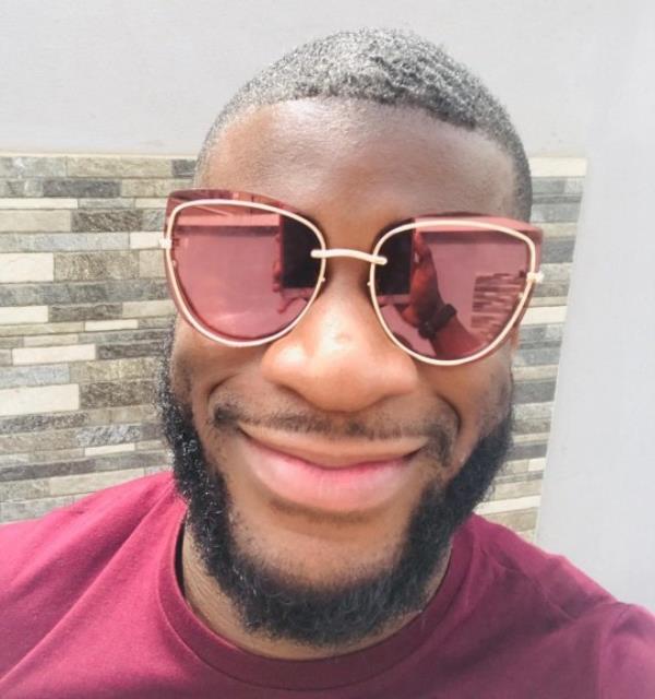 Darren Sho<em></em>neye smiling while wearing sunglasses