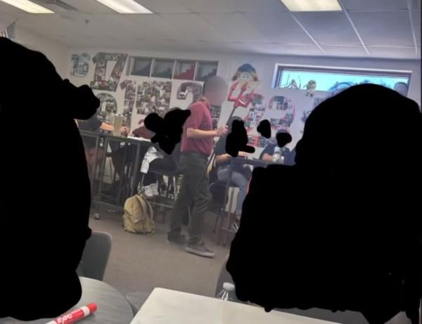 An Arizona high school teacher has been removed for allegedly dressing up as the devil and greeting students entering his classroom with 