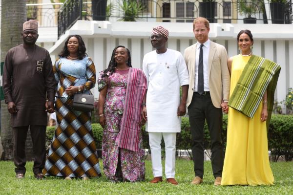 Nigeria Chief of Defense Staff Christopher Musa (L), his wife Lilian Musa (2ndL), Lagos State Governor wife, Ibijoke Sanwo-Olu (3rdL), Lagos State Governor, Babajide Sanwo-Olu (3ndR), Britain's Prince Harry (2ndR), Duke of Sussex, and Britain's Meghan (R), Duchess of Sussex, pose for a photo at the State Governor House in Lagos on May 12, 2024 as they visit Nigeria as part of celebrations of Invictus Games anniversary.