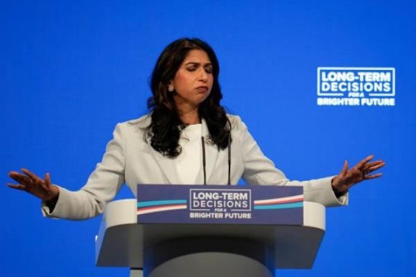 MANCHESTER, ENGLAND - OCTOBER 03: Home Secretary Suella Braverman speaks on the third day of the Co<em></em>nservative Co<em></em>nference on October 03, 2023 in Manchester, England. Home Secretary Suella Braverman will deliver her keynote speech to delegates at The Co<em></em>nservative Party Conference, at Manchester Central, and talks a<em></em>bout reducing migration to the UK. (Photo by Christopher Furlong/Getty Images)