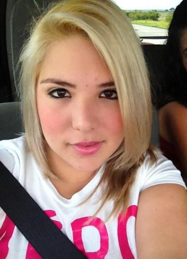 Karen Rodriguez in a car wearing seatbelt. 