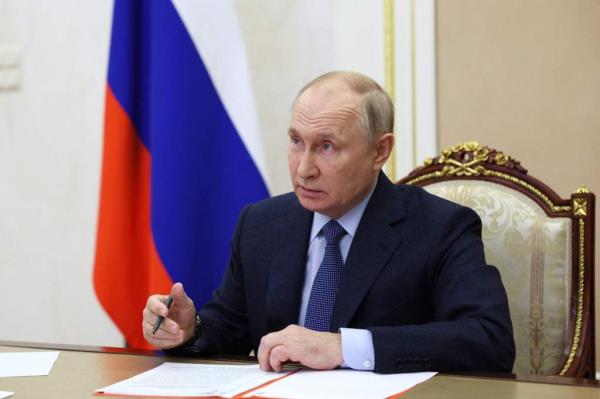 In this pool photograph distributed by Sputnik agency Russia's President Vladimir Putin chairs a meeting with Security Council permanent members via video l<em></em>ink in Moscow, on October 27, 202