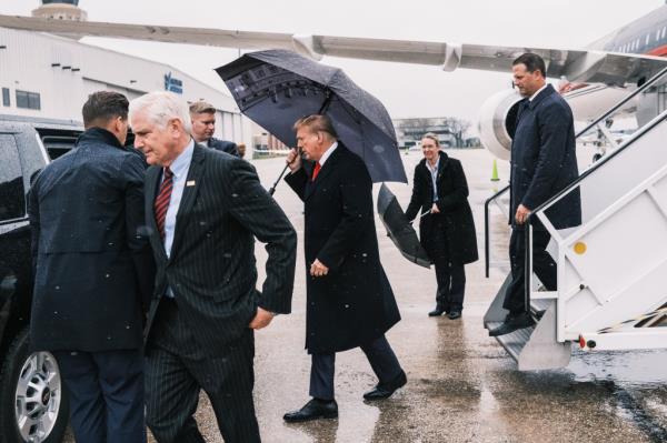 Former President Do<em></em>nald Trump arriving at MacArthur Airport in Long Island, greeted by County Executive Bruce Blakeman, to attend NYPD officer Jo<em></em>nathan Diller's funeral