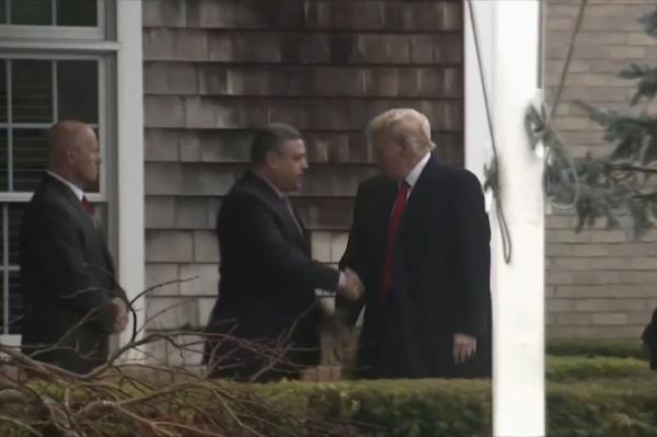 Trump shook hands on his way inside the building.