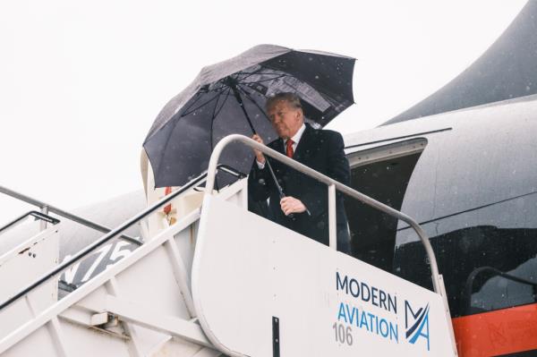 Former president Do<em></em>nald Trump arriving at MacArthur Airport in Long Island, greeted by County Executive Bruce Blakeman, to attend NYPD officer Jo<em></em>nathan Diller's funeral.