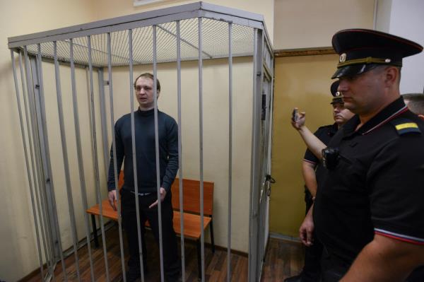 Gilman stands inside an enclosure for defendants as he attends a court hearing in Voronezh, Russia on Oct. 7, 2024.