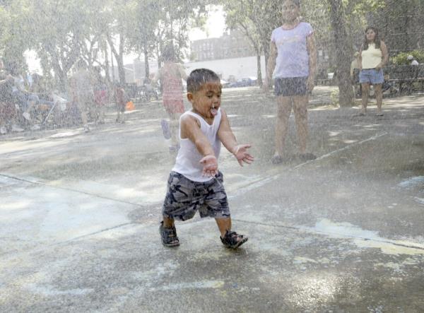  16 mo<em></em>nth old Gisu Rojas enjoys the water fountain at the Thomas Noo<em></em>nan Playground 