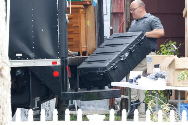 A large heavy duty case is removed.