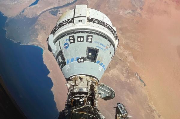 Boeing Starliner craft docked to the Internatio<em></em>nal Space Station