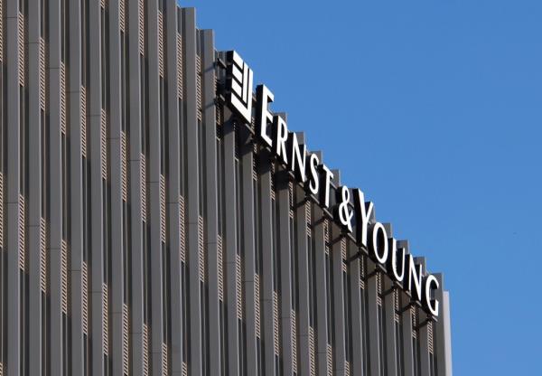 Ernst & Young is laying off dozens of partners in its US offices amid declining revenues in the accounting sector.