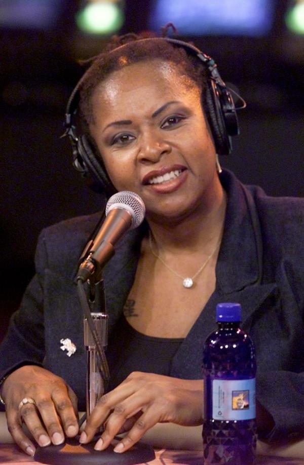 Robin Quivers with hair, wearing headphones.