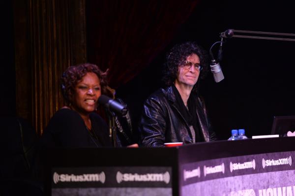 Robin Quivers sitting next to Howard Stern.