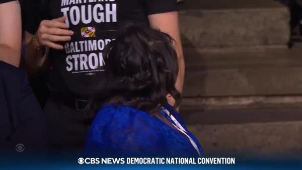 The woman seemingly catches wind of her image being plastered on the jumbotrons and quickly shifts her body away from the camera before it cuts back over to Winfrey.