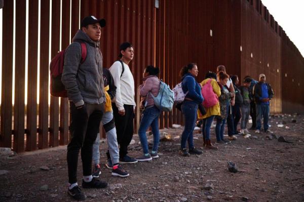 Asylum seekers who crossed the U.S.-Mexico border wall turn themselves in to U.S. Customs and Border Protection officers in the Tucson sector on Tuesday, February 13, 2024 in Lukeville, Arizona. 