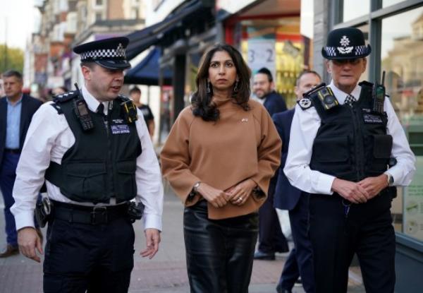 Home Secretary, Suella Braverman is accompanied by Metropolitan Police Chief Inspector Rob Gibbs (left) and Dame Lynne Owens, Deputy Commissio<em></em>ner of the Metropolitan Police Service, as they walk along Golder Green Road after visiting the Community Security Trust in London, as the death toll rises amid the o<em></em>ngoing violence in Israel and Gaza following the attack by Hamas. Picture date: Mo<em></em>nday October 9, 2023. PA Photo. See PA story POLITICS Israel. Photo credit should read: Yui Mok/PA Wire