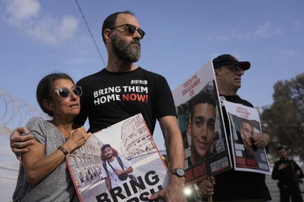 Rachel Goldberg, left, and Jon Polin centre, parents of Israeli-American hostage Hersh Goldberg-Polin, along with other relatives of hostages take part in a protest calling for their release in the Kibbutz Nirim, southern Israel.