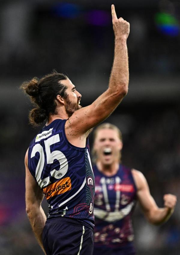 Alex Pearce points to the sky.