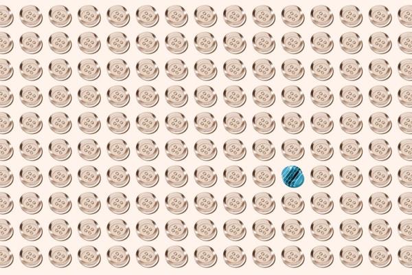 Blue striped button in a crowd of transparent buttons arranged in a grid on solid beige background