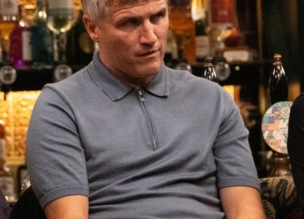 Caleb in the pub during the meeting with the Dingles in Emmerdale