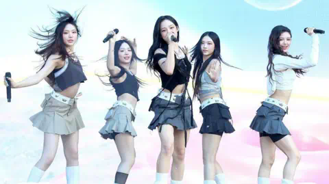 Getty Images (L - R) Hyein, Hanni, Minji, Haerin and Danielle of NewJeans perform in co<em></em>ncert during Lollapalooza in Chicago, 2023