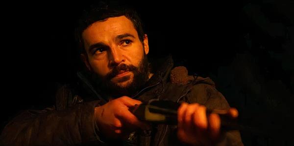 Christopher Abbott points a gun in Bring Them Down still
