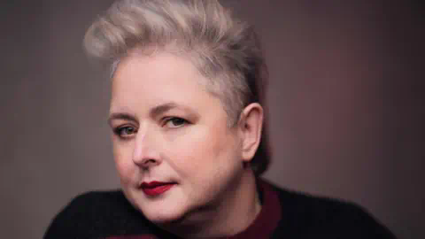 RTé Headshot of Siobhán McSweeney wearing a black and red jumper